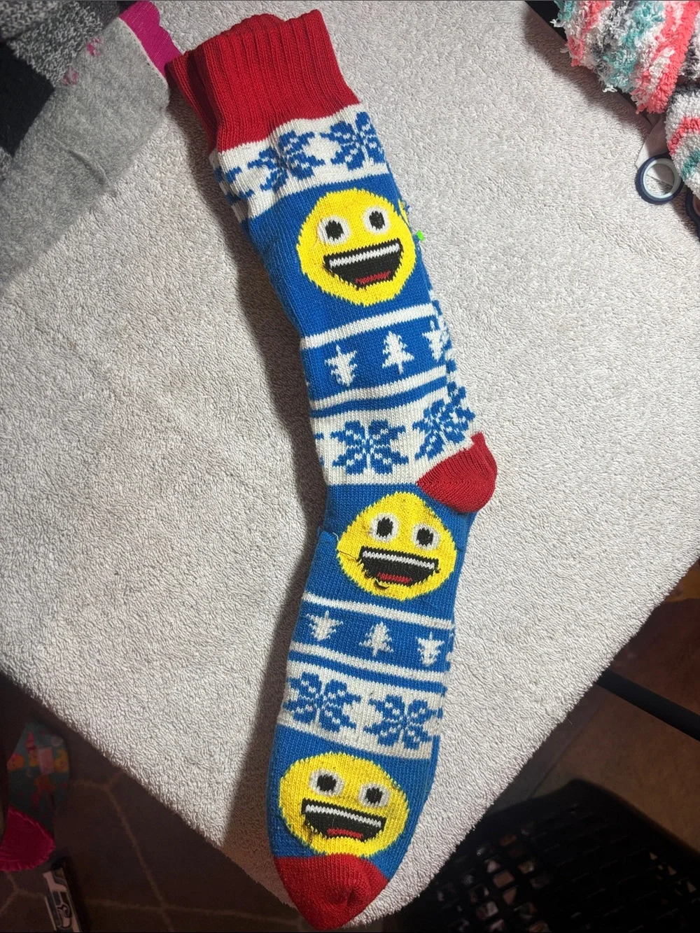 Source Unknown Blue Knit Holiday Stocking with Yellow Emoji and Red Trim